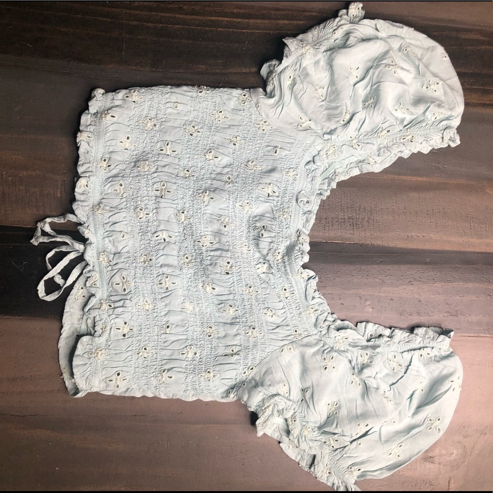 Light blue, off the shoulders crop top.